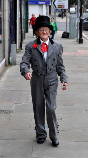 Rita Cunningham dresses for the day as she makes her way towards the market hall