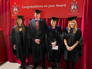 Supporting image for story: Officers celebrating after completing studies