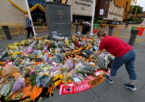 Tributes to former Wolves player Diogo Jota outside Molineux. Photo: Tim Thursfield