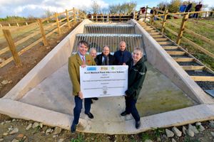 With Philip Dunne MP unveiling the plaque is Anne Wheeler, Chair English Severn and Wye Regional Flood & Coastal Committee, Cllr Peter Nutting (Shropshire Council leader), local Cllr David Turner and Malcolm Price (Flood Committee Member)