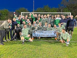 Supporting image for story: Emerald Athletic glowing as they lift silverware