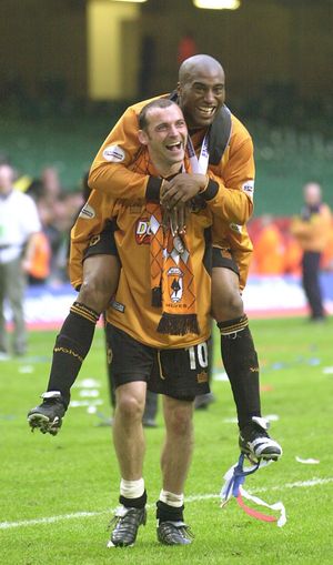 Dean Sturridge takes a piggy back from Colin Cameron.