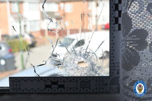 Image of bullet hole in window