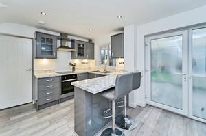 There is a modern, fitted kitchen