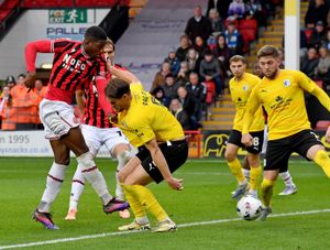 Daniel Kanu halves the deficit for Walsall.