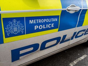 A Metropolitan Police vehicle with police marking on side