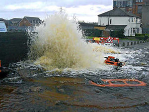 Supporting image for story: Tipton road flooded as water main bursts