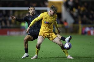 Tom Sang of Shrewsbury Town and Jack Taylor of Sutton United