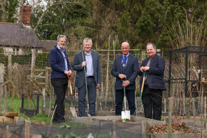 Centre manager Grant Wilson, left, in the community allotments down the meadow with Richard Woolley, Councillor David Mills and Councillor David Evans