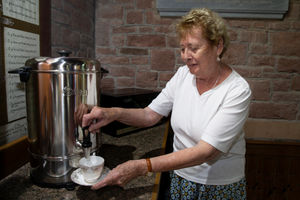 Pictured Wendy Horan, Church Warden, with the new water boiler, funded by Anwyl Homes.