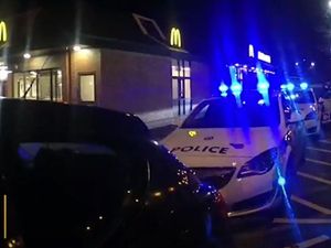Supporting image for story: Moment £500,000 car theft gang is caught at McDonald's drive-thru by police