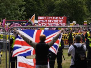 Supporting image for story: Protesters stage demo outside hotel used to house migrants