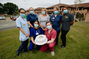 Sandra Ogden donated her son's wedding cake to the Covid 19 ward. In Picture L>R: Anna Salazar, Rachel Brown, Aqsa Saleem (front), Sandra Ogden (Cake Maker in middle), Daniel Pearson (front), Louise Jenkinson and Narinder Dahiya..