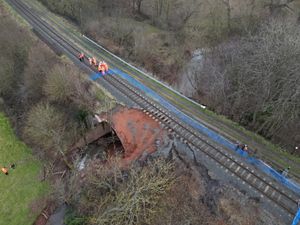 Network Rail engineers inspecting the damage.