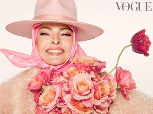 Supporting image for story: Linda Evangelista poses for British Vogue with face held with tape and elastic