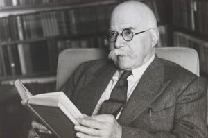 Arthur Ransome in his study