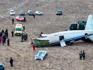 Supporting image for story: Four bodies recovered and dozens more feared dead after Kazakhstan plane crash