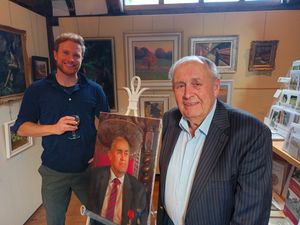 Milner Whiteman OBE with his portrait and the artist Jacob Gourley.