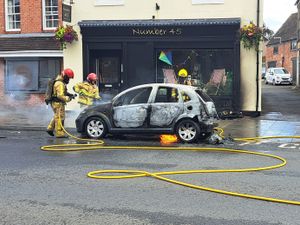 Supporting image for story: Car destroyed by fire in town high street incident 