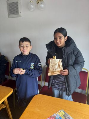 Kids enjoying the hot food provided by Miss P Carribean.