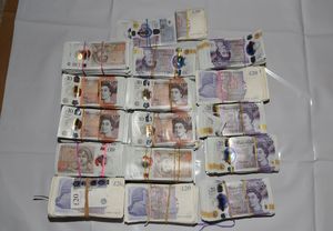 Cash was found hidden in a bed in Sutton Coldfield. Photo: National Crime Agency