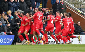 Alex Penny celebrates his goal...