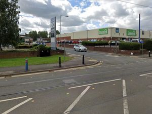 Supporting image for story: Woman "trapped beneath car" on major city road