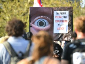 Supporting image for story: Nine sought by police after officers injured in lockdown protest clashes