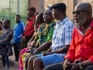 People line up before the opening of the polling stations