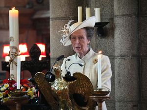 Princess Royal giving a reading in a church