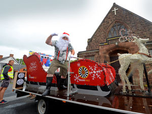 Supporting image for story: Santa's summer surprise: Volunteers on sleigh collect for church foodbank