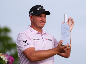 Sepp Straka poses with the trophy after winning the 2025 Truist Championship in Philadelphia