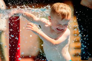 A youngster having fun at Shrewsbury's splash park in the Quarry