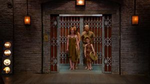 Naomi and Dan entering 'The Den'