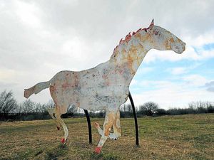 Supporting image for story: Graffiti-hit and peeling horse sculptures on train route look like 'scabby osses'
