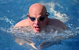 Dozens of friends, family and colleagues of the fire service have taken part in the swim