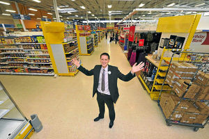 Store manager Richard Betts prepares to welcome Tesco customers