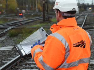 A Network Rail engineer inspecting train tracks