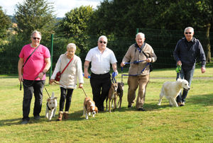 Left to right: Councillor Jon Bodenham with his dog Brian, Carole Evans with Alfie, Town Clerk Matthew Sheehan with Rosa, Peter Cuthbert with Cody, and Peter Cole with Tillie