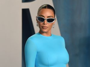 Supporting image for story: Kim Kardashian cradles large black spider in new American Horror Story trailer