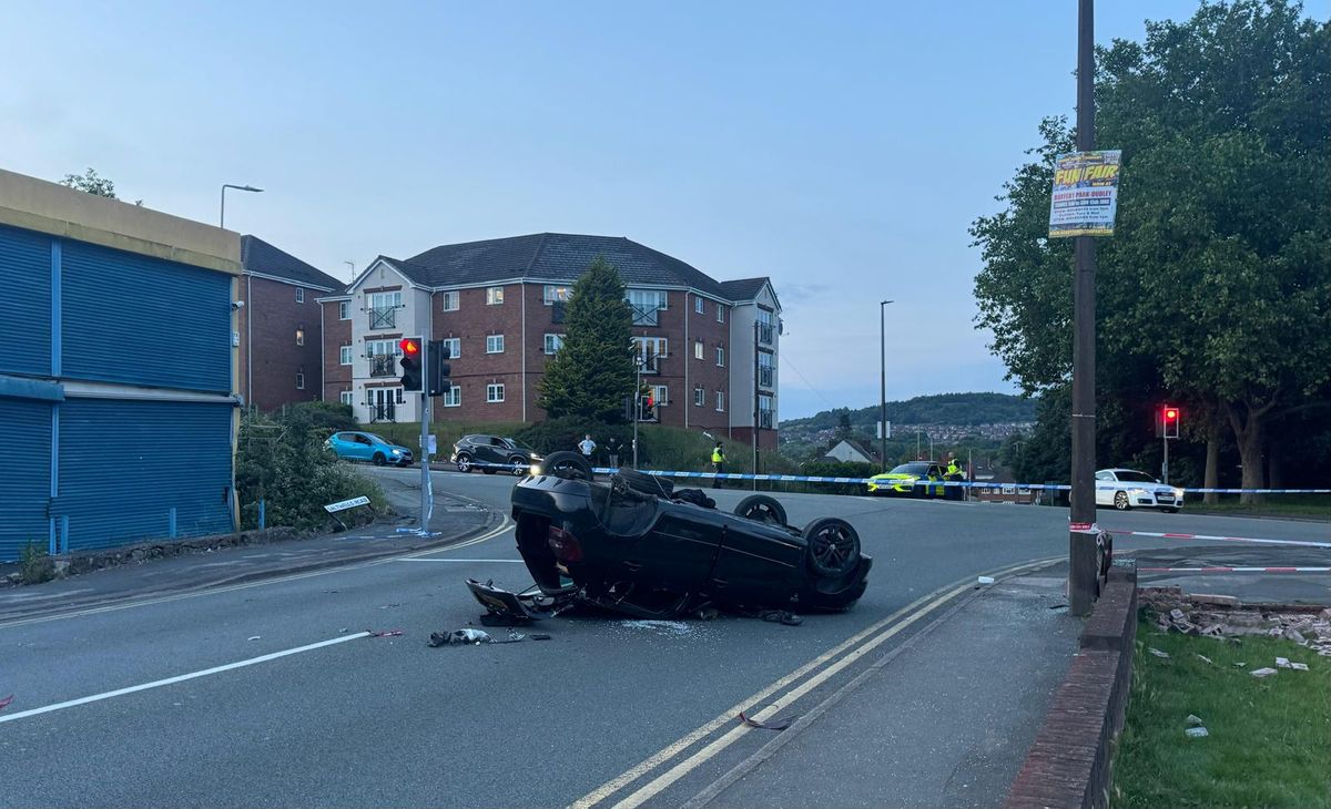 Car left on roof after two-car collision at Netherton road junction