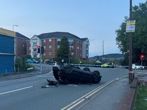 Supporting image for story: Car left on roof after two-car collision at Dudley road junction