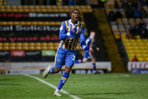 Fejiri Okenabirhie of Shrewsbury Town celebrates after scoring a goal to make it 3-2 (AMA)