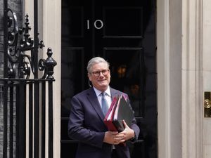 Keir Starmer smiling outside 10 Downing Street