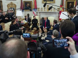 JD Vance, centre right, speaks with Ukrainian President Volodymyr Zelenskyy, centre left, as Donald Trump, centre, listens in the Oval Office