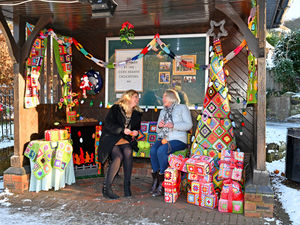 Supporting image for story: Bus shelter transformed into beautifully cosy living room by crocheting crafters