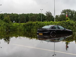 Supporting image for story: West Midlands weather: Downpours leave cars stranded in flood water