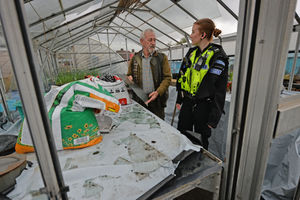 Jim Payne and PC Emily Hamilton-Hughes at the Wood Green Allotments, which have been repeatedly vandalised over the last week and a half. 