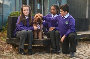 With the school dog Mr Wilko is (left to right) Grace Peters Nala Ogun, and Dinis Bras