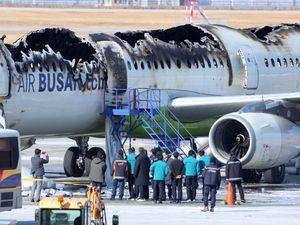 Supporting image for story: Passengers evacuated after plane catches fire at South Korean airport